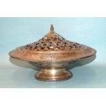 An American sterling silver large bowl with pierced lid and pineapple finial, raised on pedestal