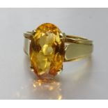 A citrine-set gold dress ring bearing Egyptian marks for 18ct gold, size N½, 5.2g.