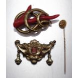 A Victorian gold-plated brooch set coral twig, another Victorian brooch set coral cameo and a