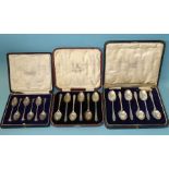 A cased set of silver coffee spoons, London 1928 and two cased sets of teaspoons, (both John