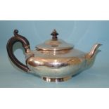 A George IV silver teapot of squat baluster form, with carved wood handle, on circular foot, maker