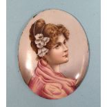 A porcelain miniature portrait of Lady Dunraven wearing flowers in her hair and a puce-coloured