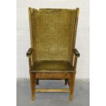 An Orkney rush-back armchair, the iron-screwed pine frame with rush back and labelled for