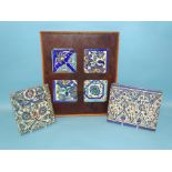 Four Islamic tile fragments in an oak frame and two similar tile sections, 19th century and earlier,