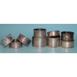 Three hammered silver napkin rings, maker DJS, London 1990 and six other silver napkin rings, ___7.
