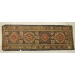 An early-20th century Oriental corridor runner, 264 x 95cm, (worn) and three other worn and