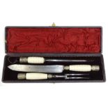 A cased white metal and ceramic-handled three-piece carving set by John Ha**ey & Sons, Silversmiths,