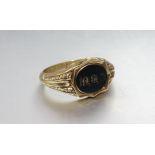 A Victorian gold signet ring set bloodstone seal "T.B.M.", size T, 2.5g.