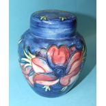 A Moorcroft ginger jar and cover with anemone tubelined decoration on a blue ground, impressed