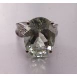 A 9ct white gold ring set orthoclase feldspar between diamond-set shoulders, size P, 5.1g.