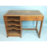 An Edward Barnsley oak writing desk of simple design, the rectangular top with inset leather writing
