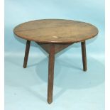 A 19th century oak circular cricket table on chamfered legs, 68cm diameter.