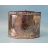 A silver tea caddy of oval form with engraved decoration, chased rims and hinged lid, E Baker & Son,
