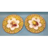 A pair of Royal Worcester comports painted by R Sebright, one decorated with apples and