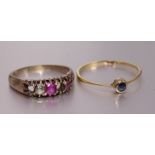 A gold ring collet-set a round-cut sapphire, mount tests as 18ct gold, size Q, 1.1g and an
