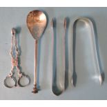 A pair of Georgian silver sugar nips of typical form, two pairs of George III sugar tongs and a