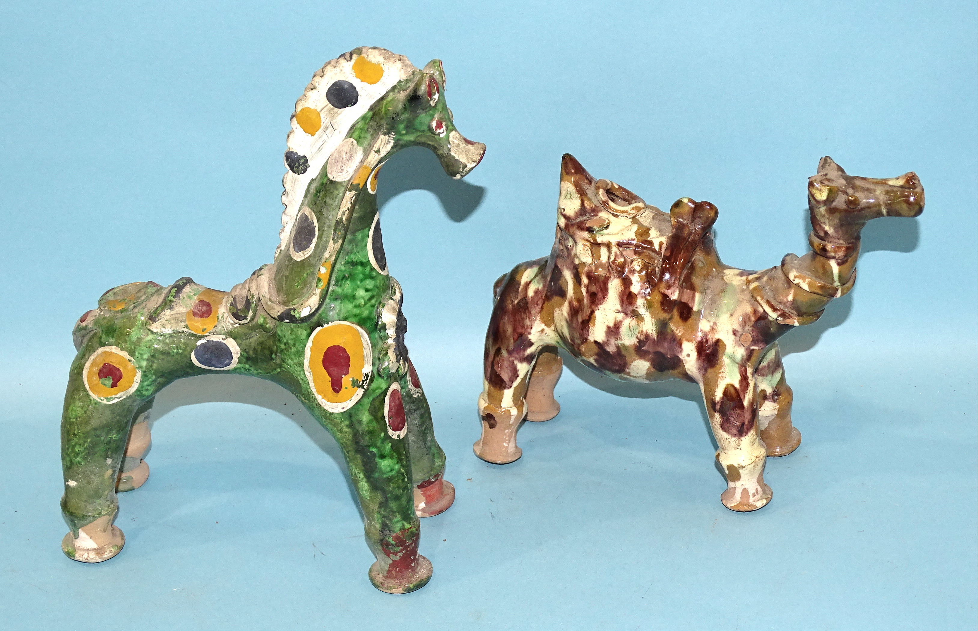 A Canakkale pottery horse vessel glazed green and painted with colours, 18cm high, 25cm long and a