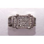 A 14ct white gold ring set a cluster of twenty-five square-cut diamonds, between shoulders each