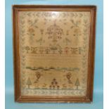 An early-19th century needlework sampler worked by Emma Wilks, June 21st 1816, the central religious