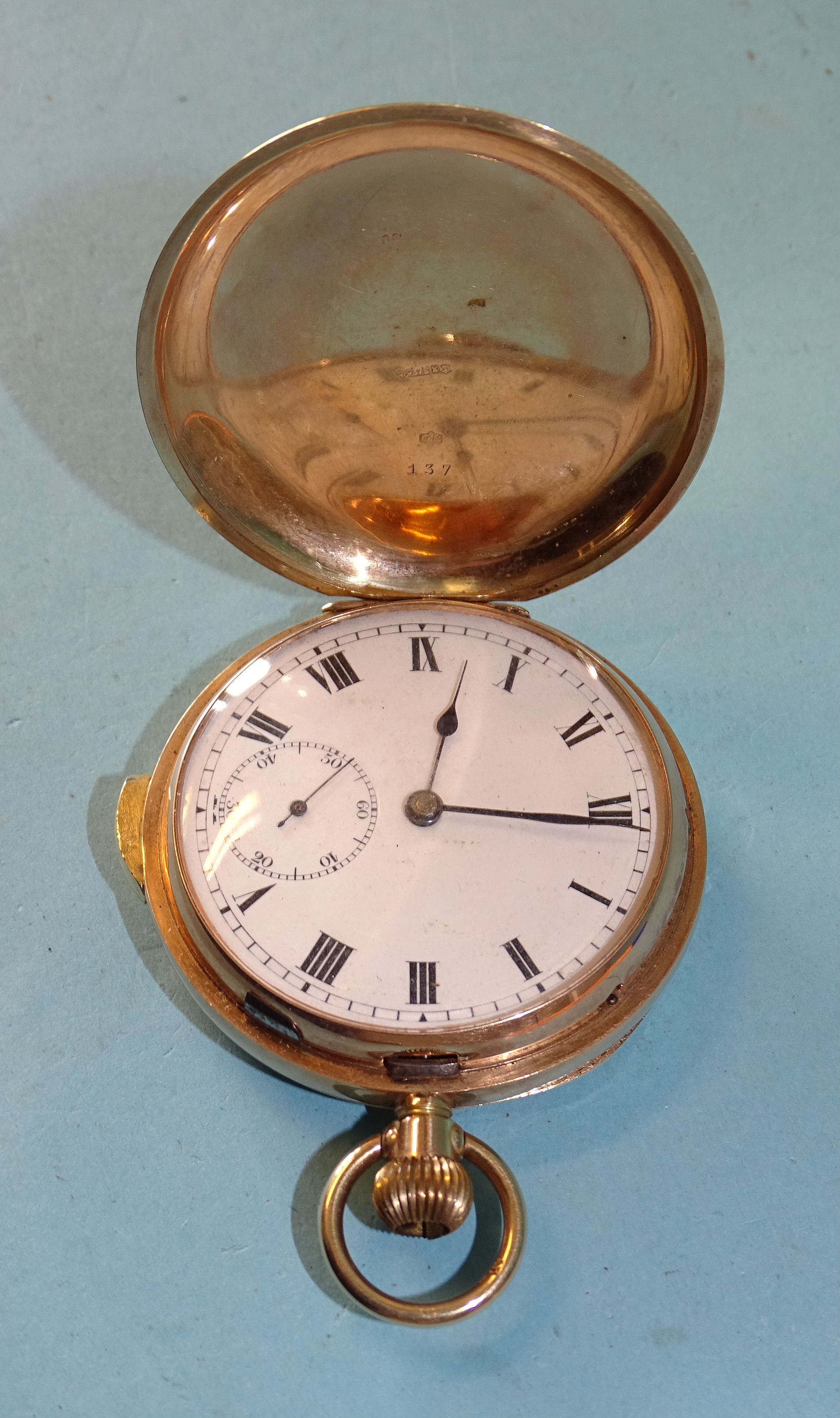 A 9ct gold hunter-cased repeater pocket watch, the white enamel dial with Roman numerals and seconds