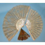 A mother-of-pearl and lace fan, the mother-of-pearl guards and sticks with pierced decoration and