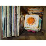 A collection of approximately 120 LP's, mainly pop, M-o-R and a quantity of 45RPM records.