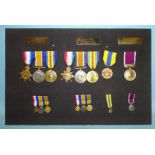 A collection of replica WWI and later medals, with miniatures.