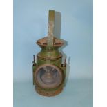 A WWII period green-painted military issue railway guardsman's lamp by C Eastgate & Sons,