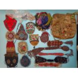 Fourteen various small beaded purses, a quantity of tiny glass beads, an embroidered silk bag and