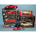 Six boxed 1:18 diecast racing cars by Burago, Maisto and three other diecast cars.