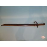 A French 1870 pattern sword bayonet marked K37832, with 55.5cm blade, in metal sheath.