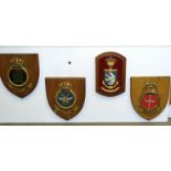 A collection of twenty-eight various naval and other plaques attached to two painted wooden boards.