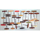 A large collection of wood-handled corkscrews.