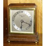 A small mahogany case Elliott mantel timepiece, the dial with Roman numerals, marked Garrard & Co.