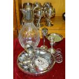 A small silver toast rack, Birmingham 1912, 8cm wide, 8cm high, a small loaded silver candlestick, a