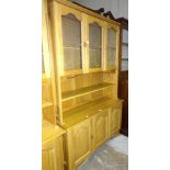 A craftsman-made oak room divider, the upper section fitted with a pair of glazed doors enclosing