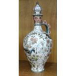 A Zsolnay Pecs lidded vase with floral and bird decoration, 27cm high, (crack to base of handle