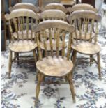 A set of seven elm and beech country dining chairs with turned spindles, (7).