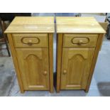 A pair of craftsman-made bedside cupboards, each fitted with a single drawer above a cupboard