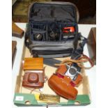 A Minolta X-300 camera and accessories, in case, a Praktica camera, a Halina 35X camera and a