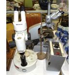 A Wild Heerbrugg binocular microscope, a Reichert binocular microscope, (both a/f), a microscope