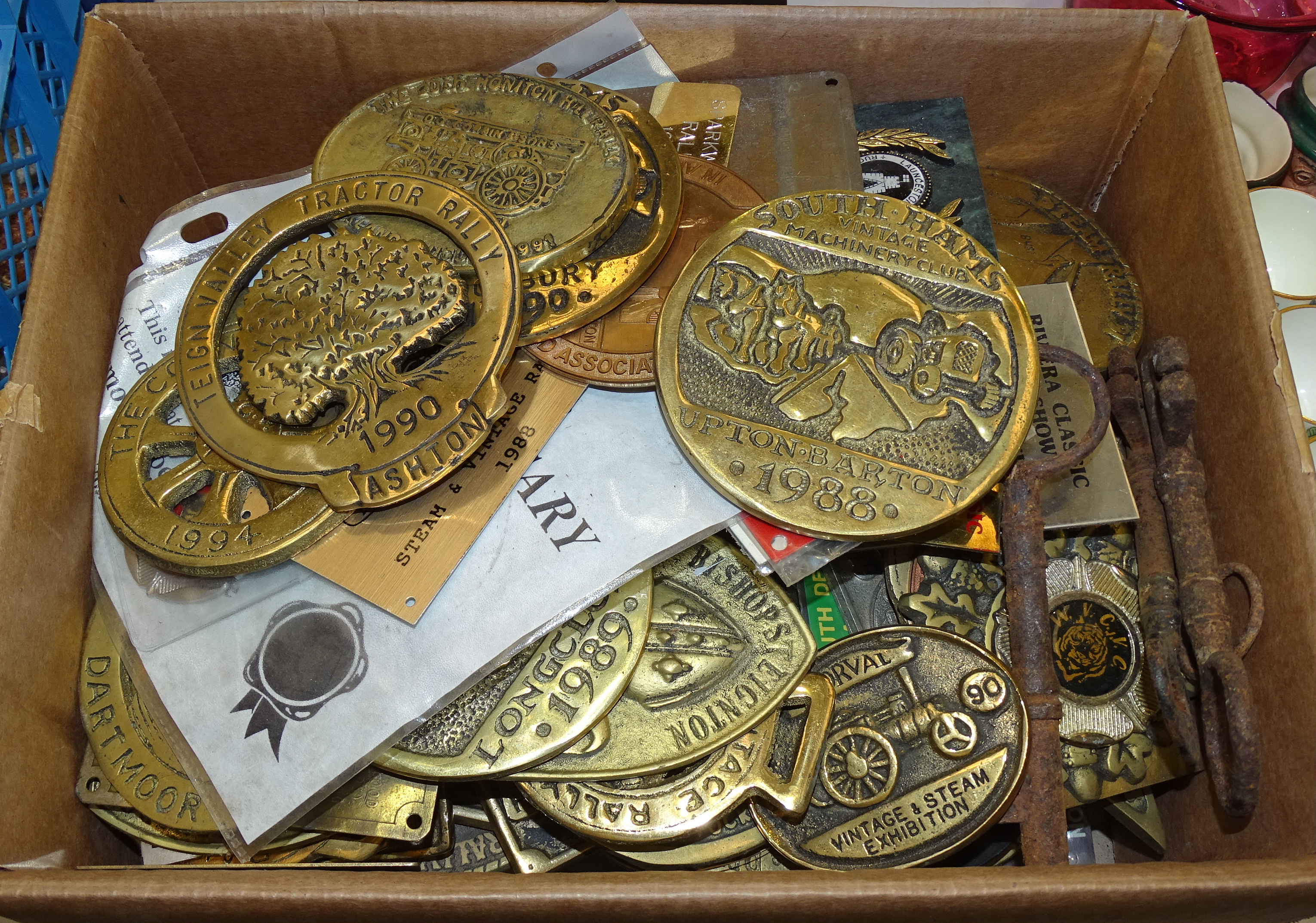 A large collection of late-1980's/1990's brass and other metal tractor and steam rally plaques, etc.