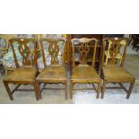 Four Georgian elm and oak country dining chairs with solid seats.