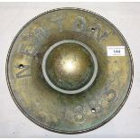 A brass boss from a ship's wheel, inscribed Newton 1883, 28cm diameter, (from the steamship