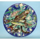 A Palissy-style wall plaque decorated with fish, eel, crayfish, reptiles, shells and reeds, on a