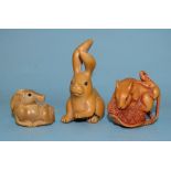 A collection of three modern Japanese netsukes, a rat with young rat and a hare carved in wood and a