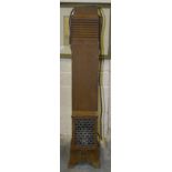 An Art Deco cast iron floor-standing electric heater, 95.5cm high, a vintage electric fan and a cast