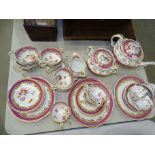 A collection of 19th century English tea-ware decorated with gilt and puce border and sprays of