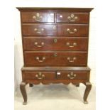 A Georgian oak chest on stand, the chest with two small and three long graduated drawers, the base