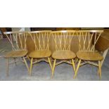 A set of four Ercol 376 candlestick lattice dining chairs together with a low sideboard fitted